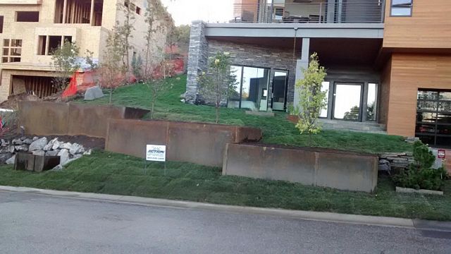 completed landscape in front of a large new modern home